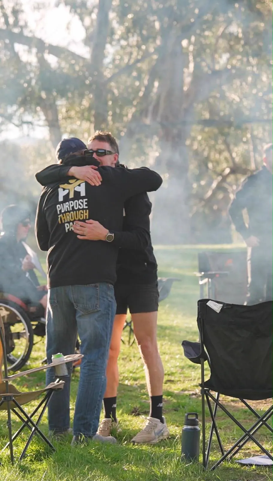 Two men embracing at the camp